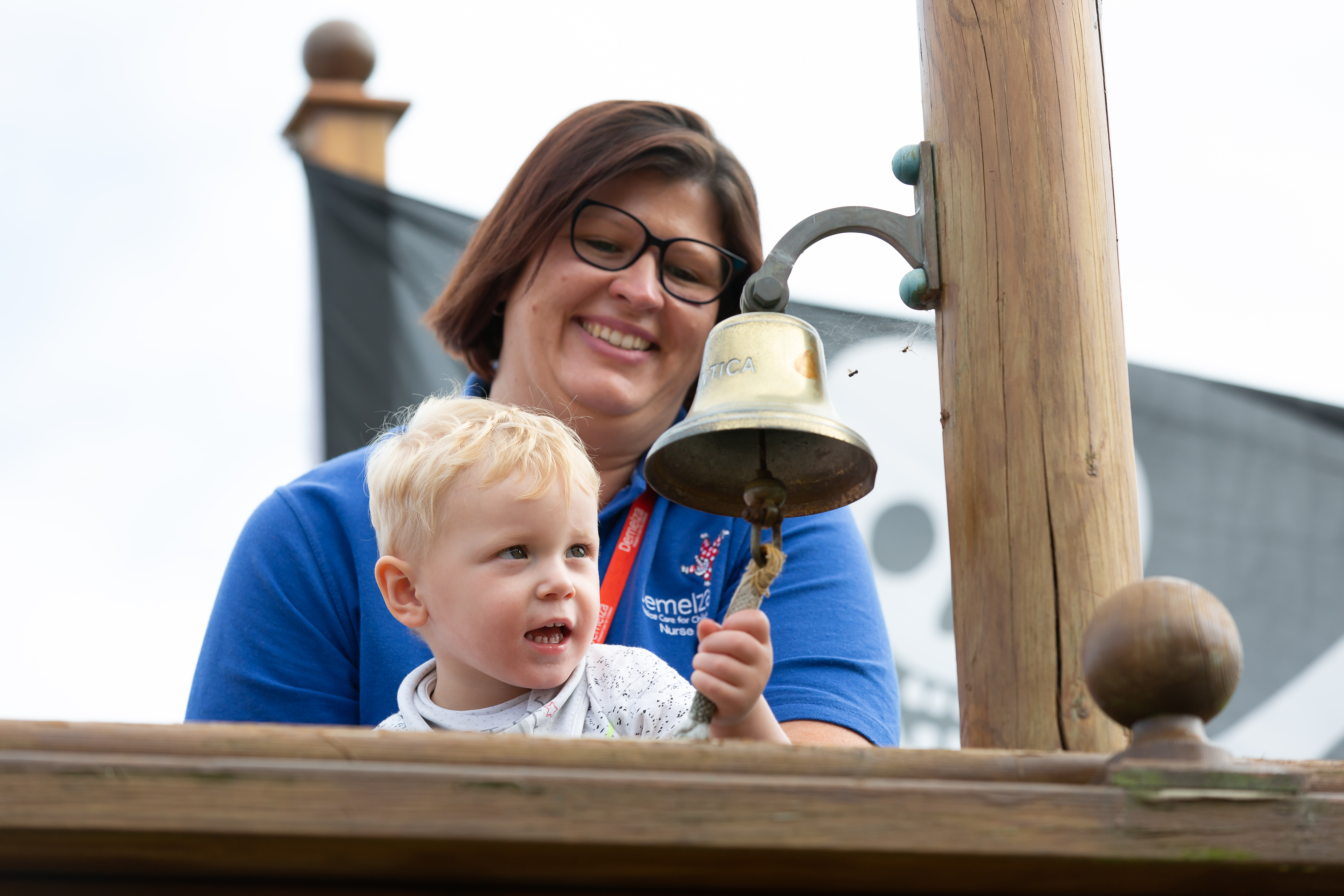 Ralph and a Registered Nurse ringing the HMS bell at Demelza Kent.