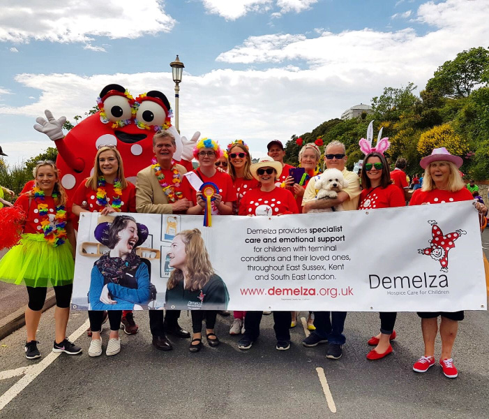 A group of people and Dottie fundraising in their community.
