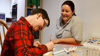 Image of Leo doing art with HCA Hettie