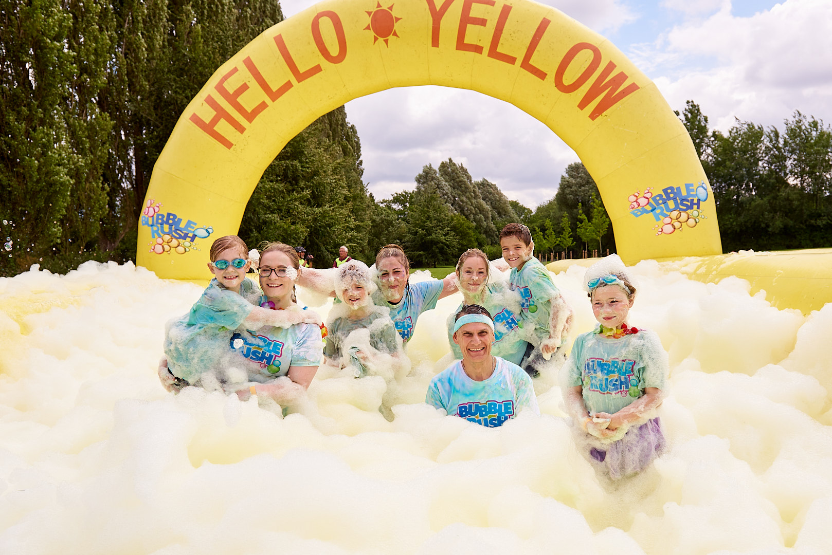Bubble Rush participants surrounded by yellow bubbles.