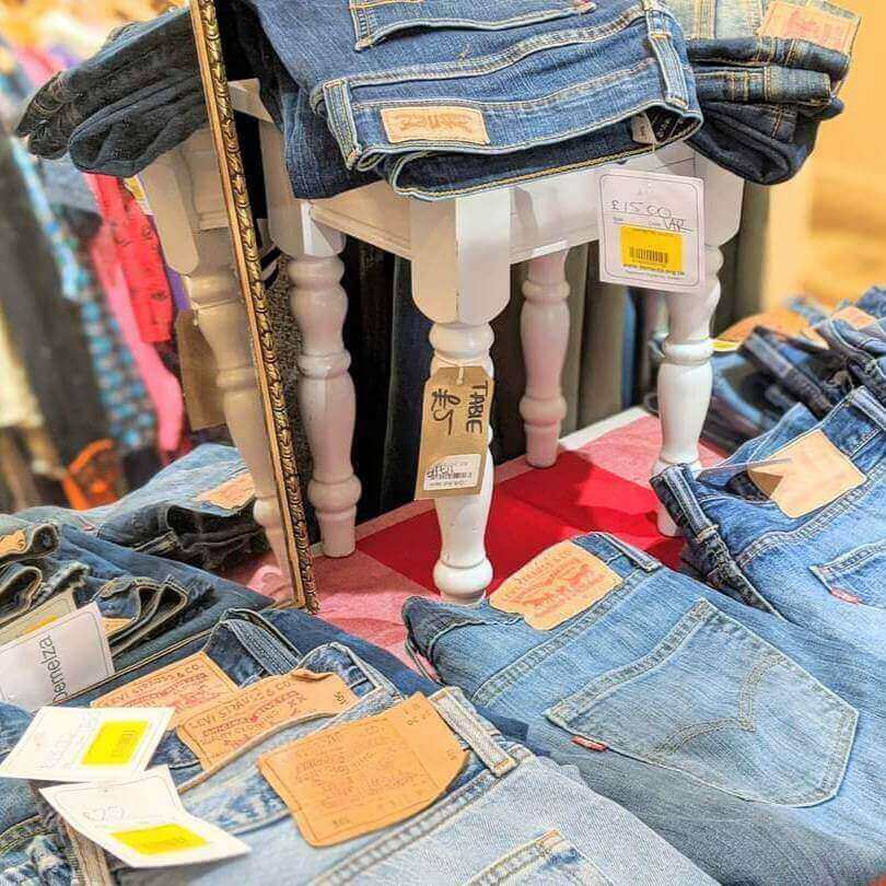 A clothing display of denim jeans.