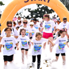 A crowd of people at the starting line running through bubbles at Bubble Rush Eltham