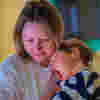 Mum and son hugging and being together