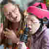 Image of child doing music therapy with a therapist