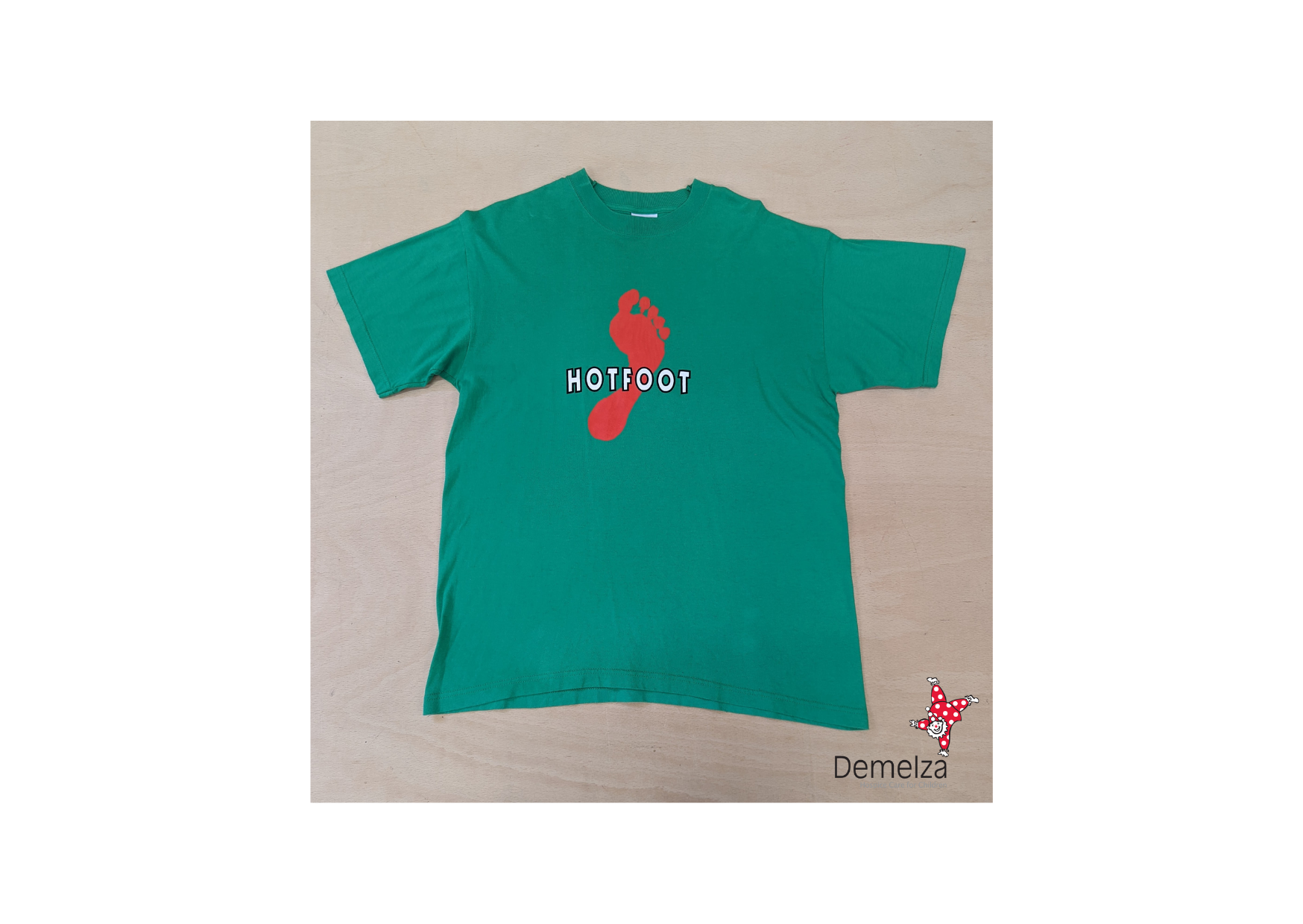 Green T shirt with red footprint graphic and "Hotfoot" spell out
