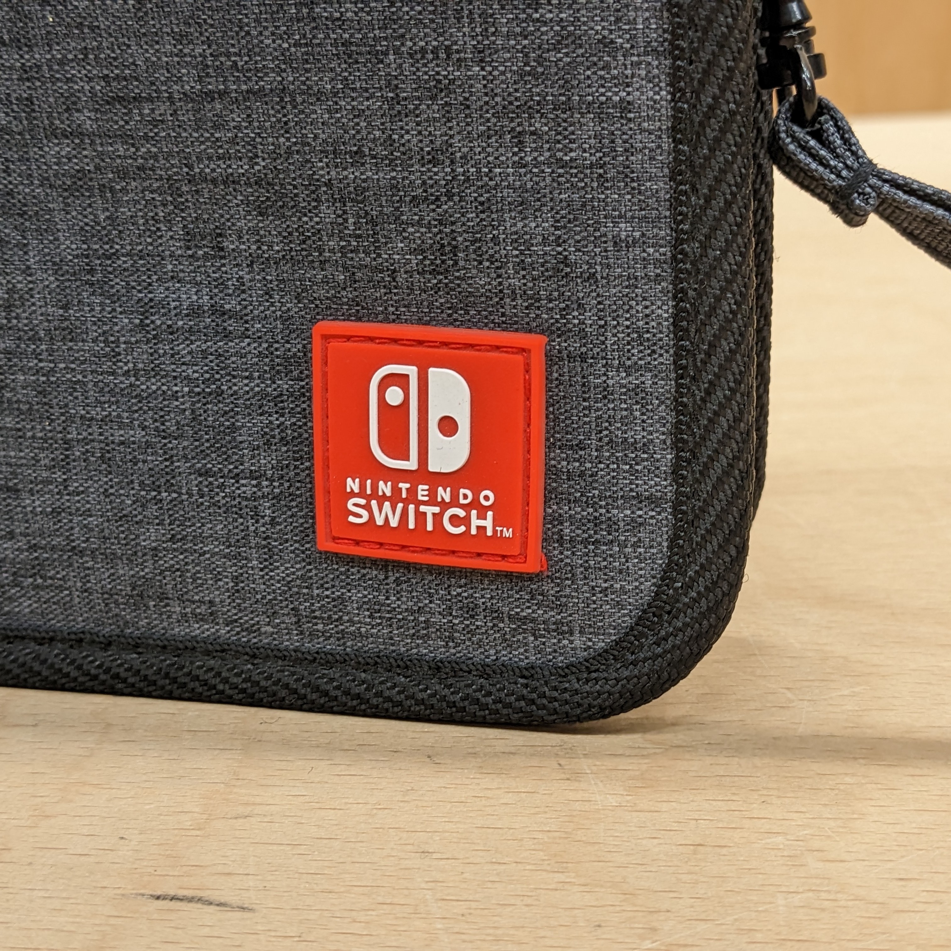 Nintendo switch official carry case close up rubber red badge