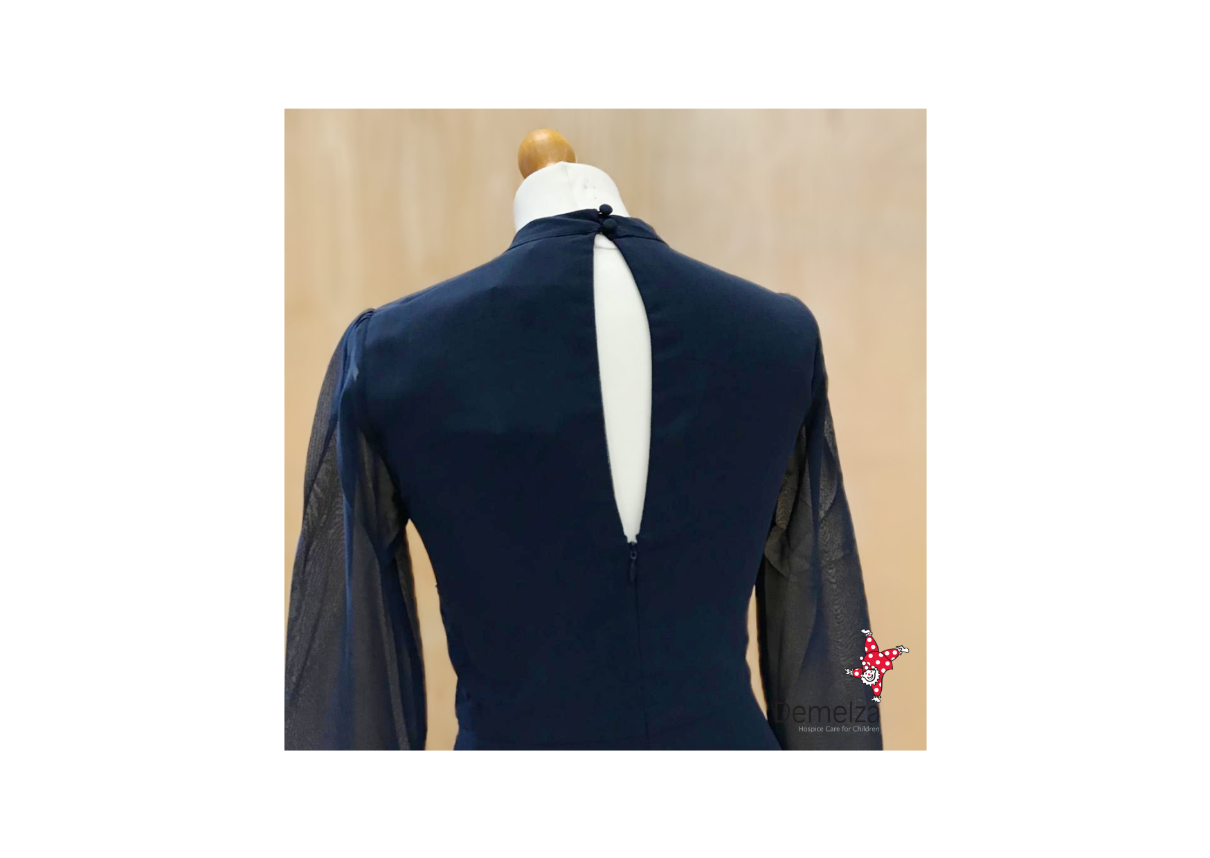 Navy dress with diamonte detailing - back view showing cut out detail