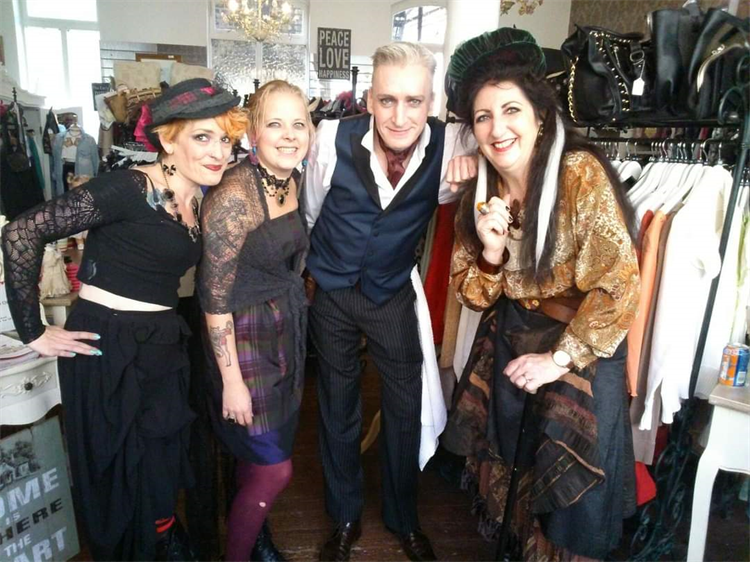Four people dressed up for the Dickens Festival in Rochester, at the Demelza Rochester Charity Shop.