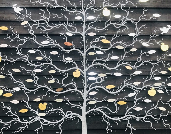 The Goodman Celebration Tree, a silver tree with copper and gold leaves.