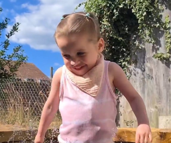 Elodie enjoying her garden