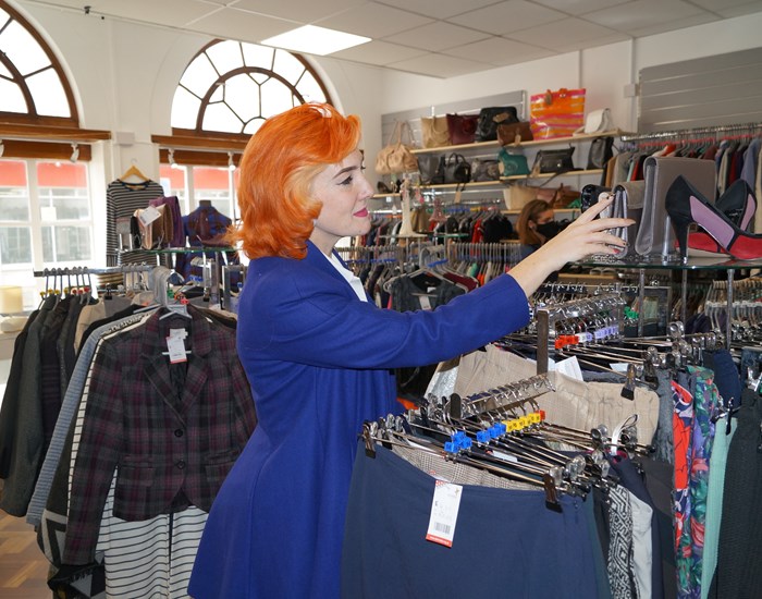 Gemma is browsing in the Canterbury Charity Shop.
