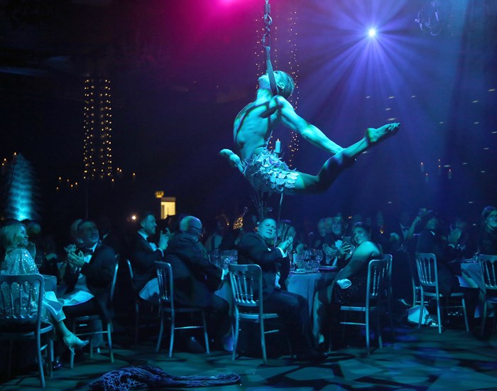 An acrobatic performer at the winter wonderland ball.