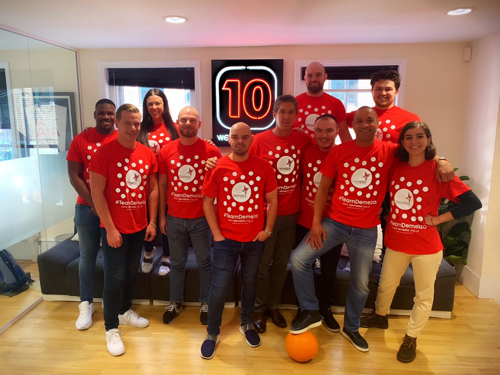 Red10 employees fundraise at work for Demelza, they are wearing Demelza polka dot tops.