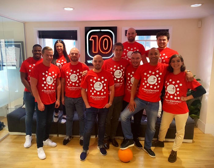 Red10 employees fundraise at work for Demelza, they are wearing Demelza polka dot tops.
