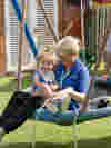 Nurse and child on swing