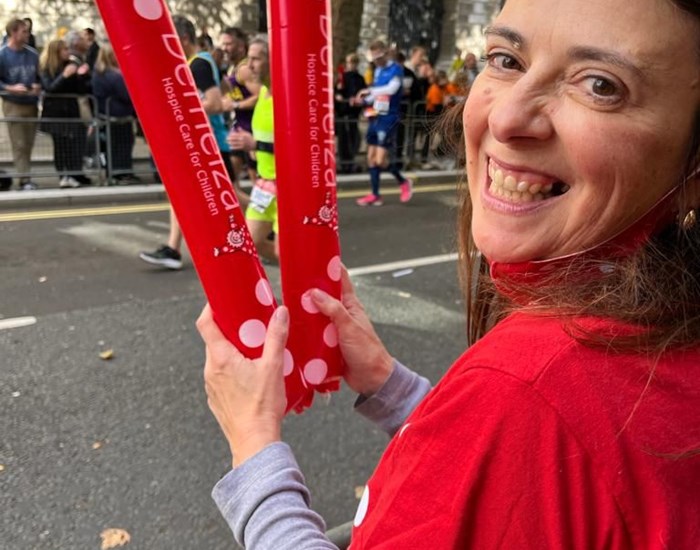Demelza staff member, Kate, cheers on runners at the London Marathon.