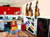 Brightly coloured East Sussex art room with guitars, musical and sensory equipment, art supplies, and toys for creative play.