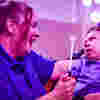 Image of sensory play with child and staff