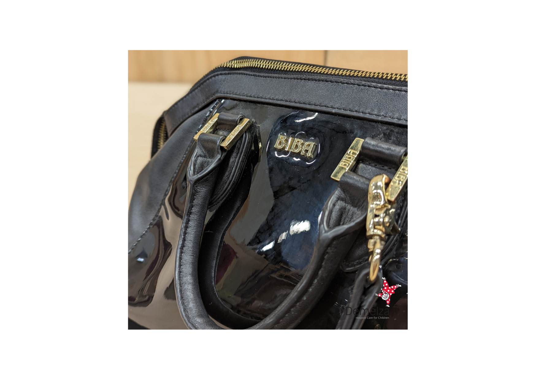 Black and gold leather Biba handbag with patent panelling to front 
