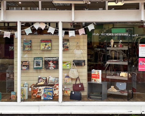 A window display with a colourful bunting.