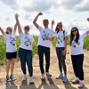Team members holding up their hands