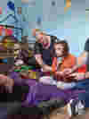 Image of family spending time in the music room for therapy