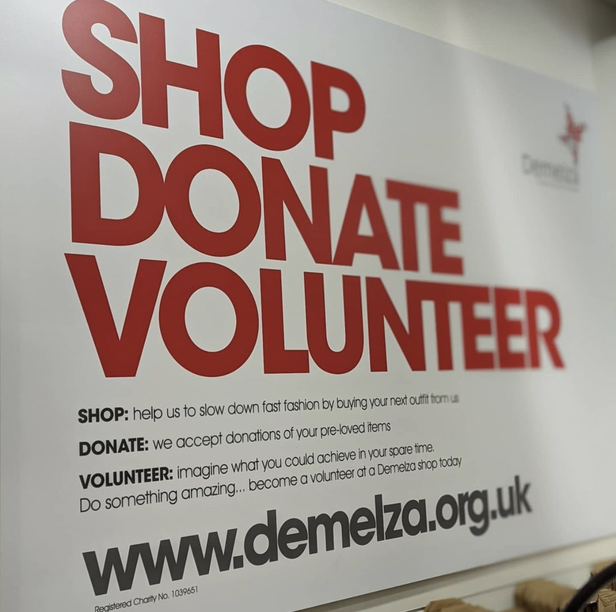 A sign which reads 'shop, donate, volunteer'.