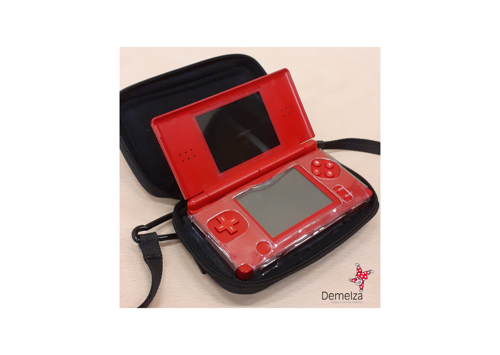 Red Nintendo DS Lite with black zip up carry case