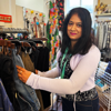 Retail Volunteer Sorting Stock At Rochester Charity Shop