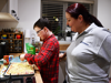 Image of Leo and Hettie making pizza