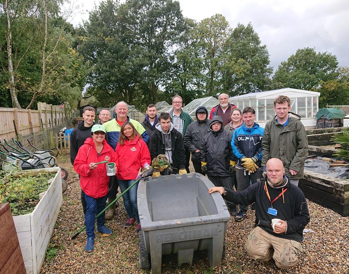 A team of supporters from Royal Mail volunteering in the gardens at Demelza.