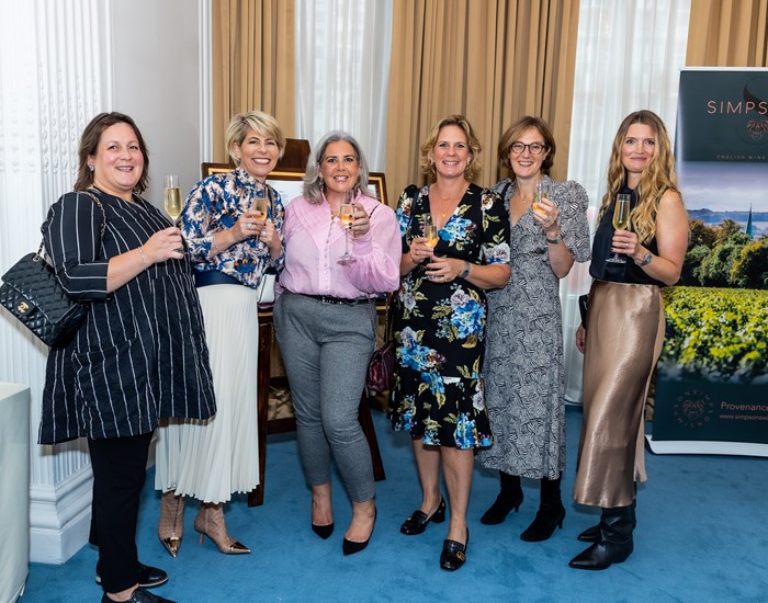 Six ladies, holding champagne at the autumn lunch.