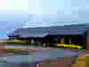 Oastview by Demelza building with a rainbow in the sky