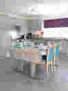 Tables and chair set-up in a kitchen setting