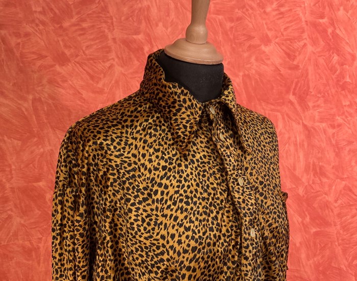 A leopard print blouse of a mannequin. 