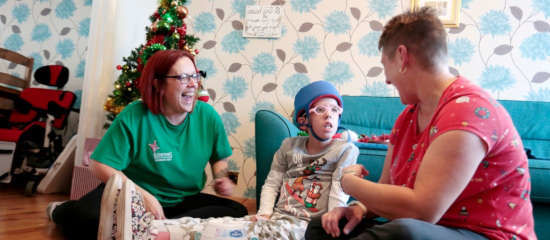 Jack receiving Care at Home from a Demelza health care assistant.