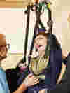Hoist being used to help young person