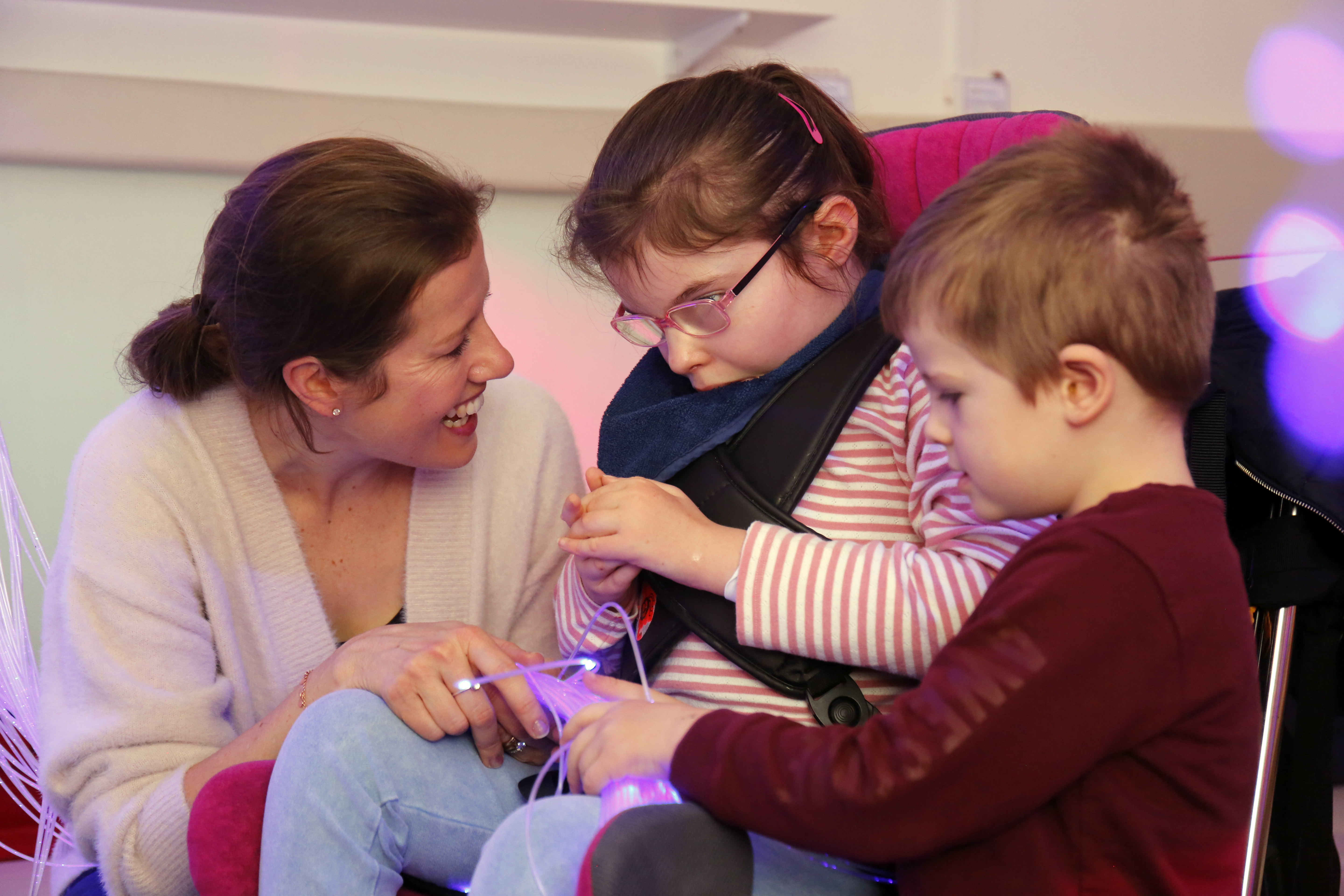 A family in the sensory room at Demelza's Eltham hospice.