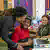 Zyan enjoying art activities with his mum and Rachel in the art room at Demelza South East London.