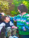 Mum and son looking at each other and smiling