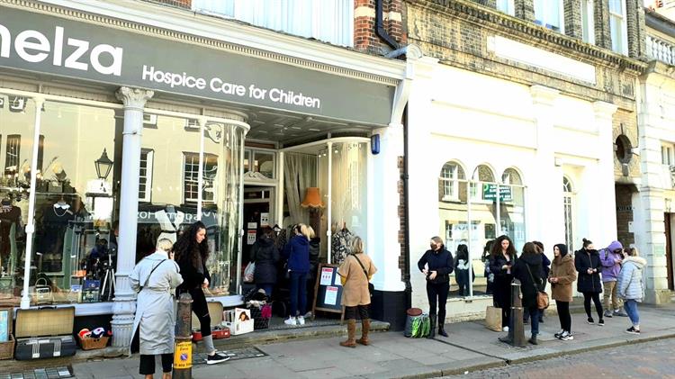 People queueing outside Demelza's Rochester charity shop.