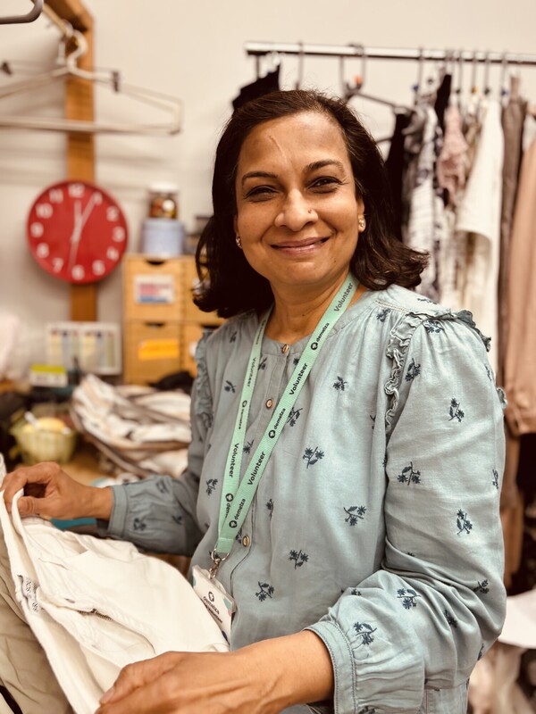 Volunteer Muneerah at Eltham Shop sorting clothes 
