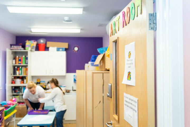 The door to the art room at Demelza is decorated with colourful letters, reading 'art room'.