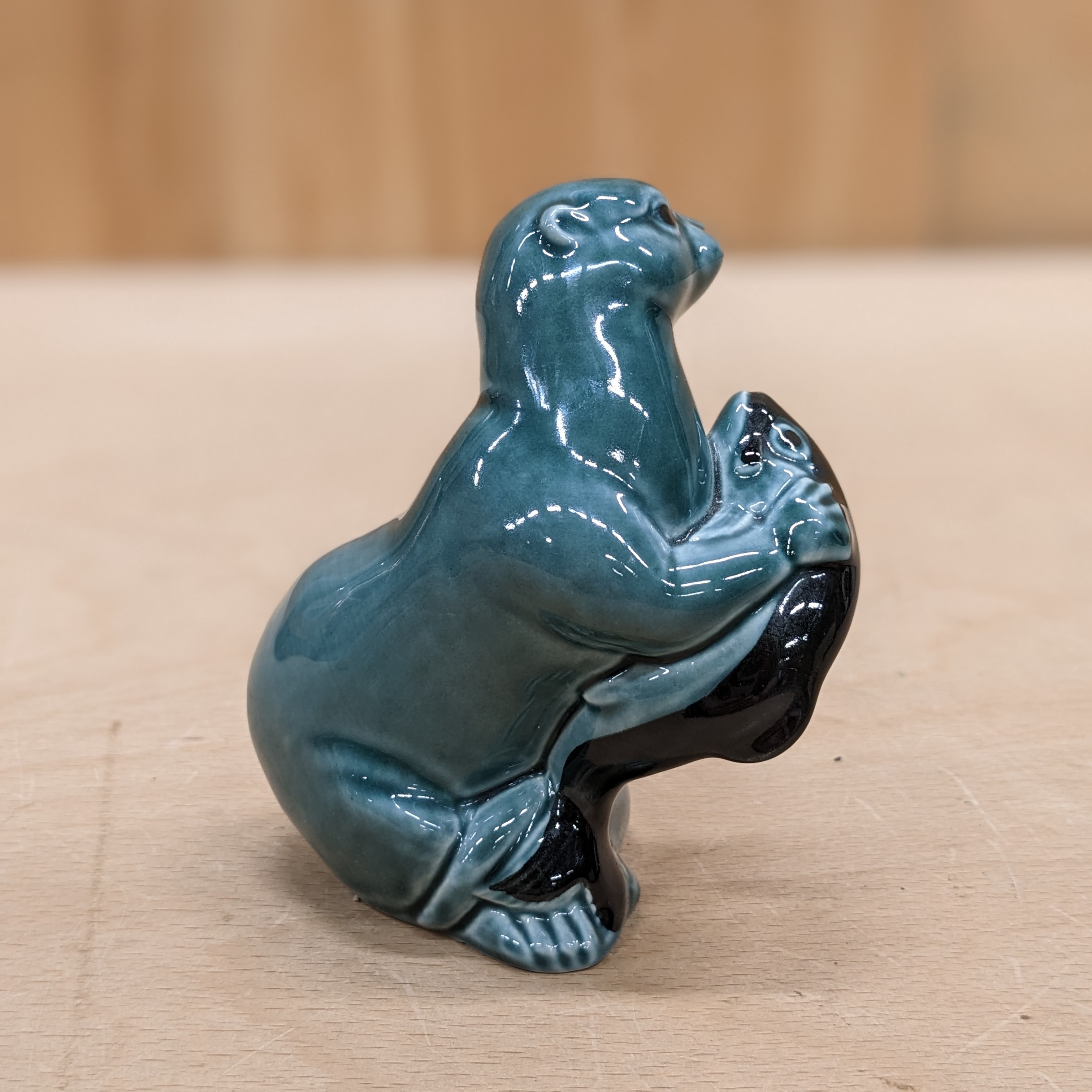 Rear view of Poole Pottery Otter Blue with Fish Figurine Ornament Vintage