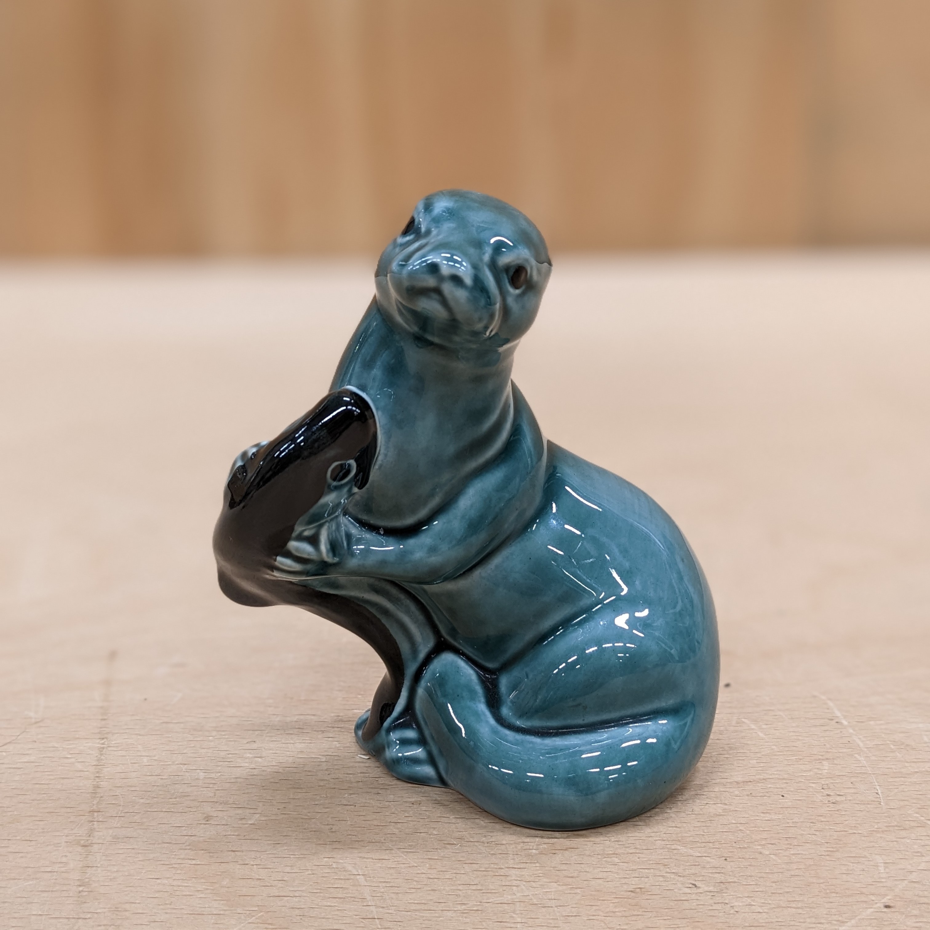 Main view of Poole Pottery Otter Blue with Fish Figurine Ornament