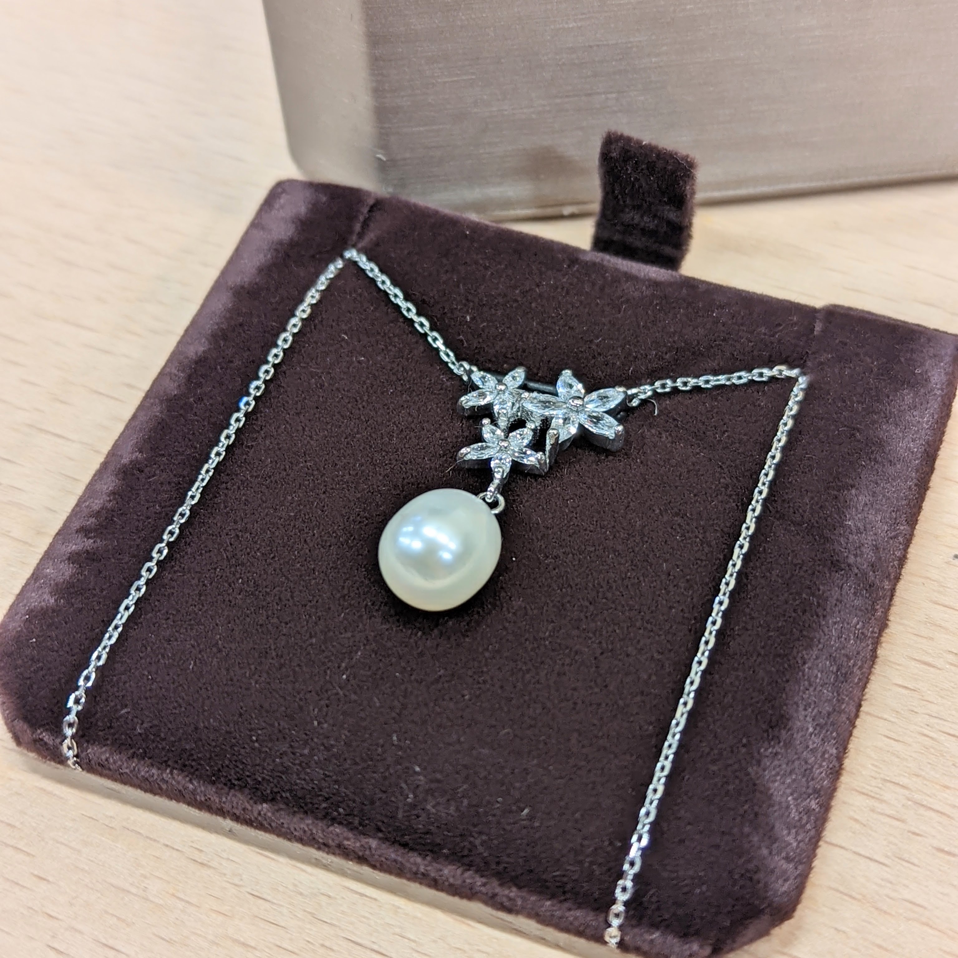 Necklace in box, side view