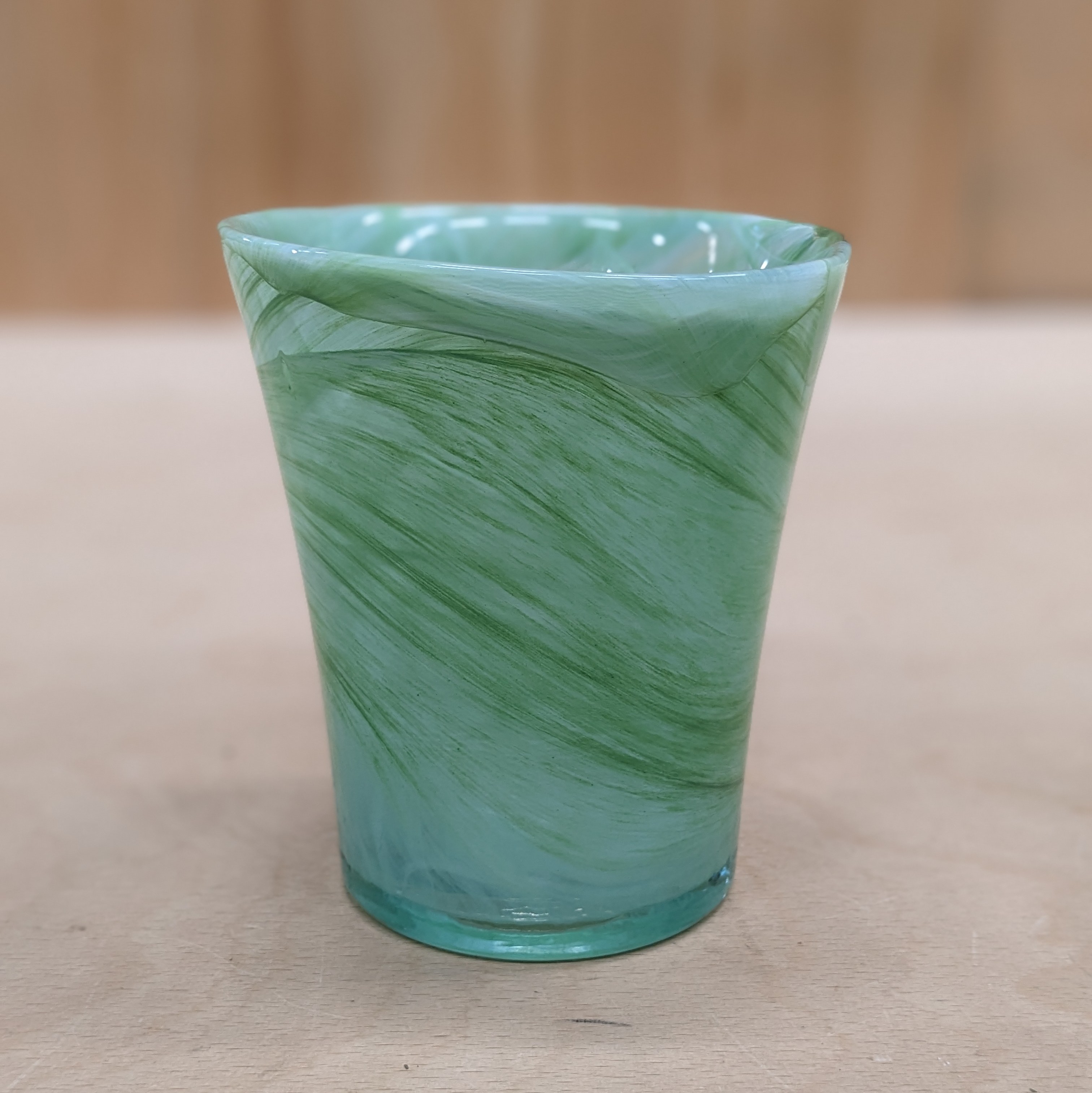 Green glass marbled vase patterned swirl design view