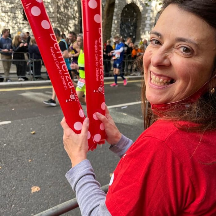 Demelza staff member, Kate, cheers on runners at the London Marathon.