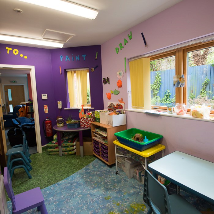 The art room at Eltham, it has purple walls and is filled with lots of art equipment.