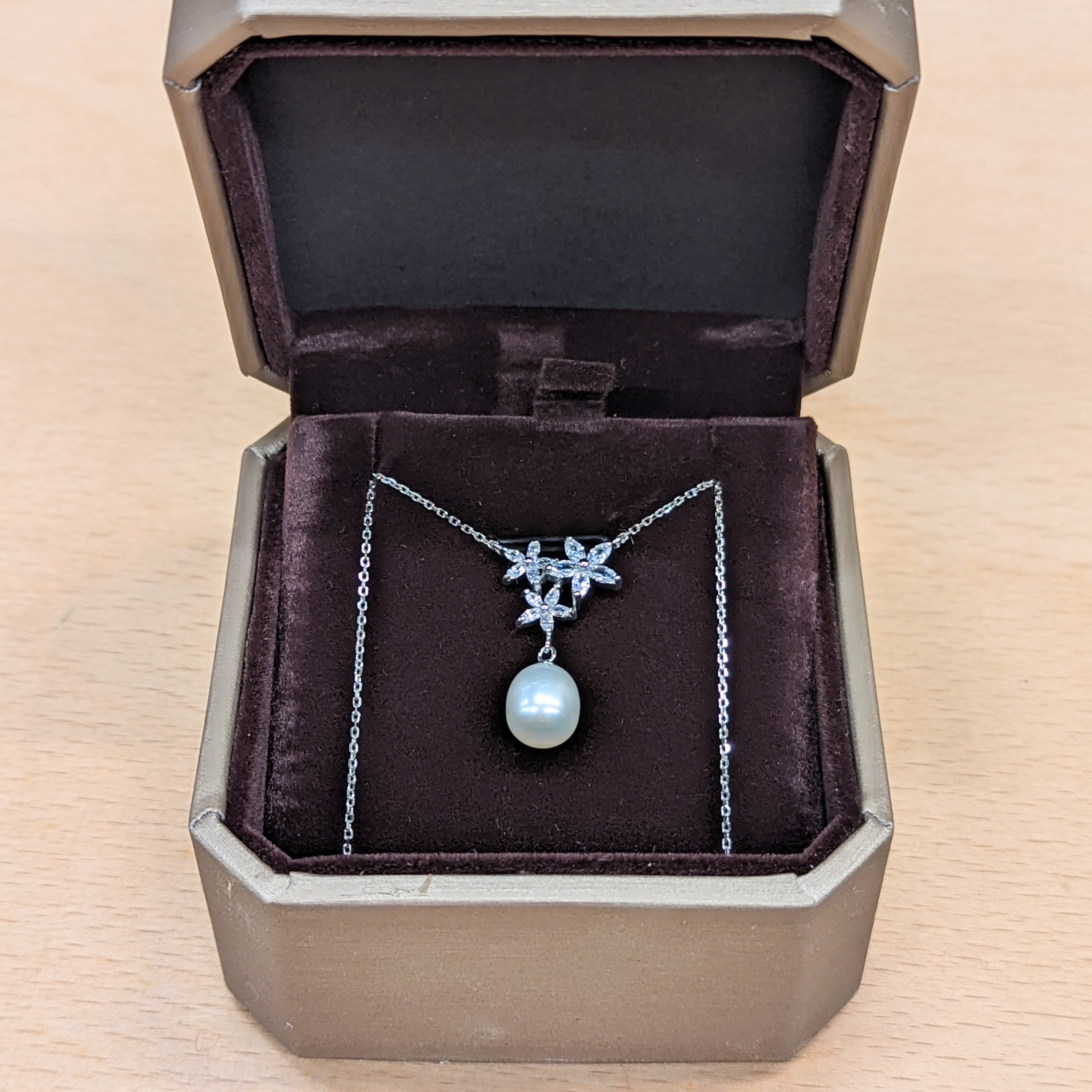 Necklace in box, front view